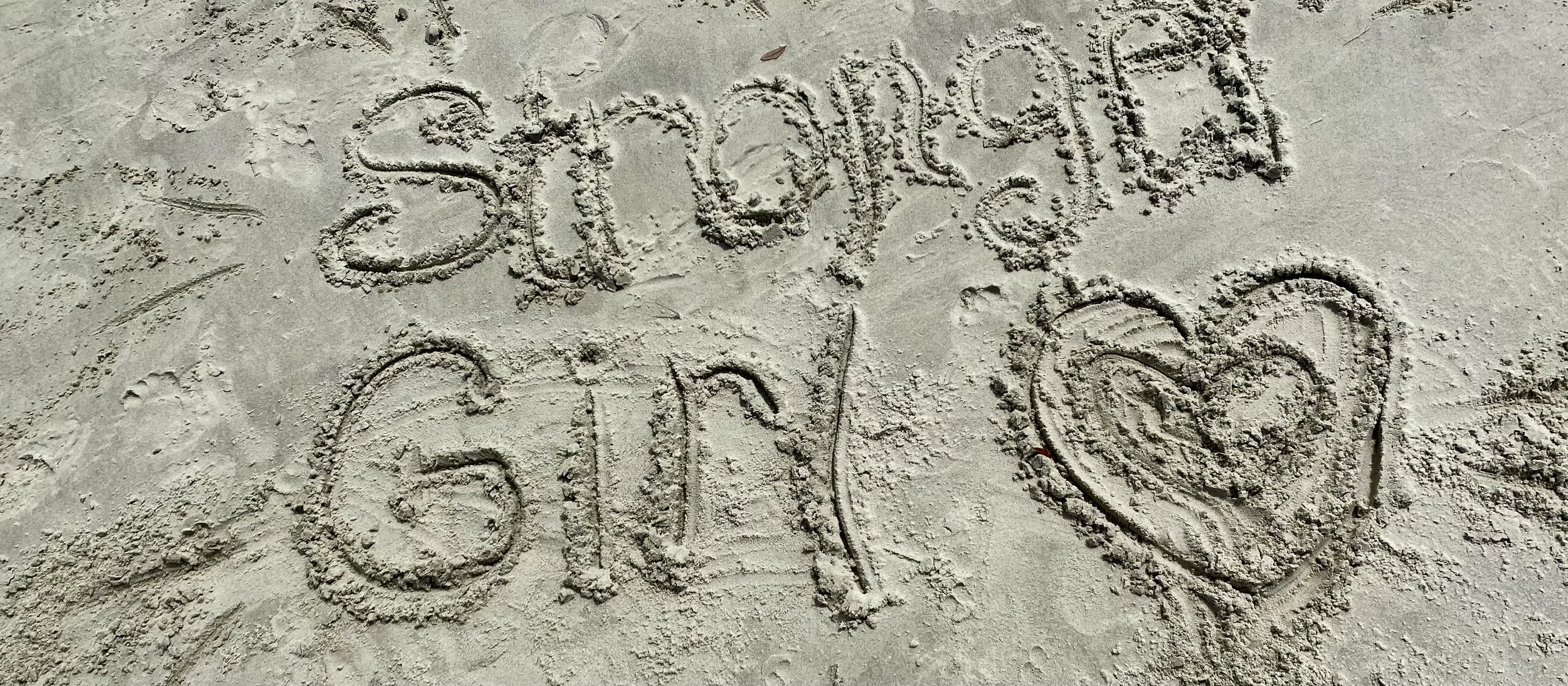 stronger girl in the sand.jpg
