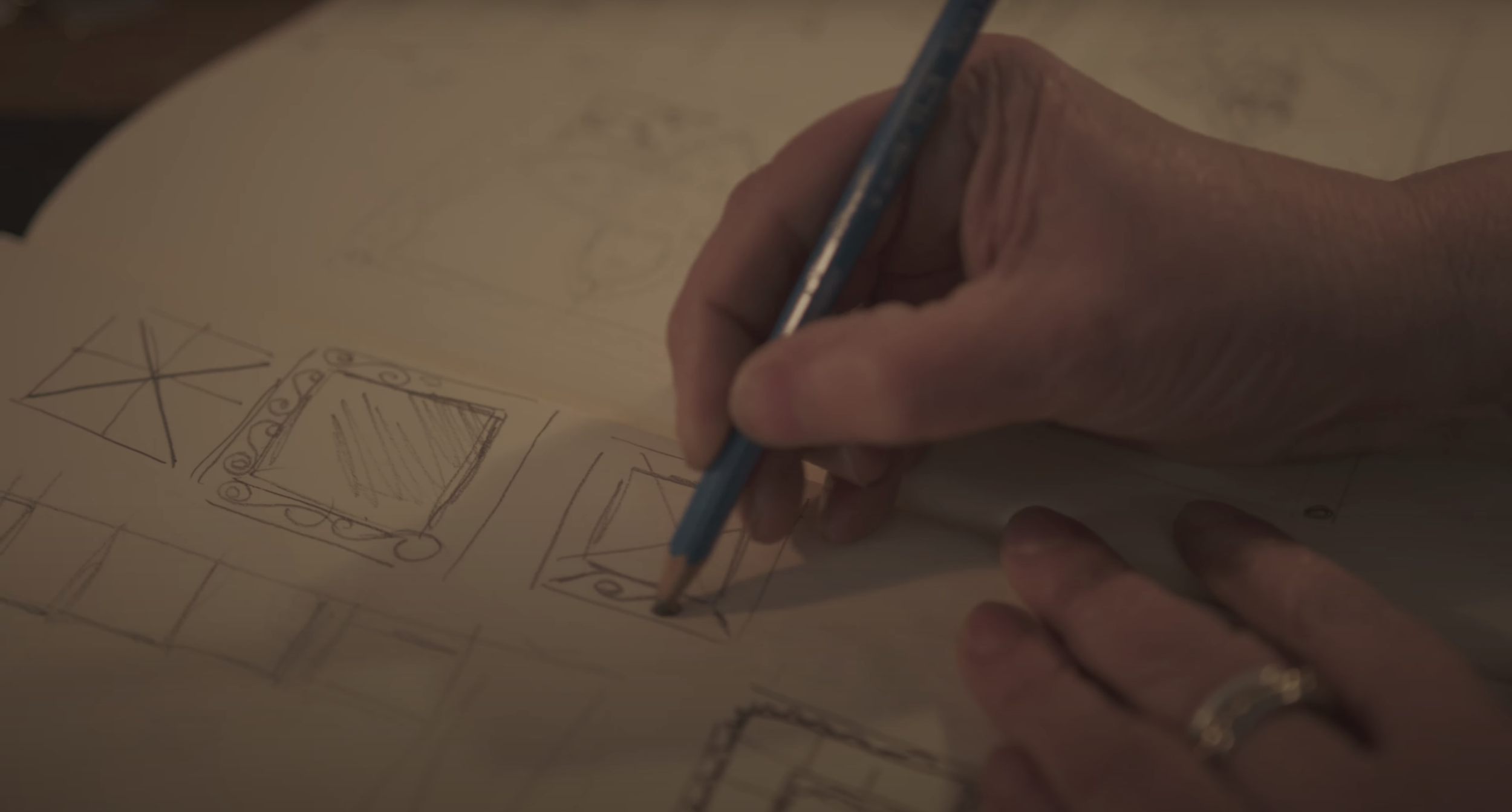 Gill Clement drawing and developing a piece of jewellery