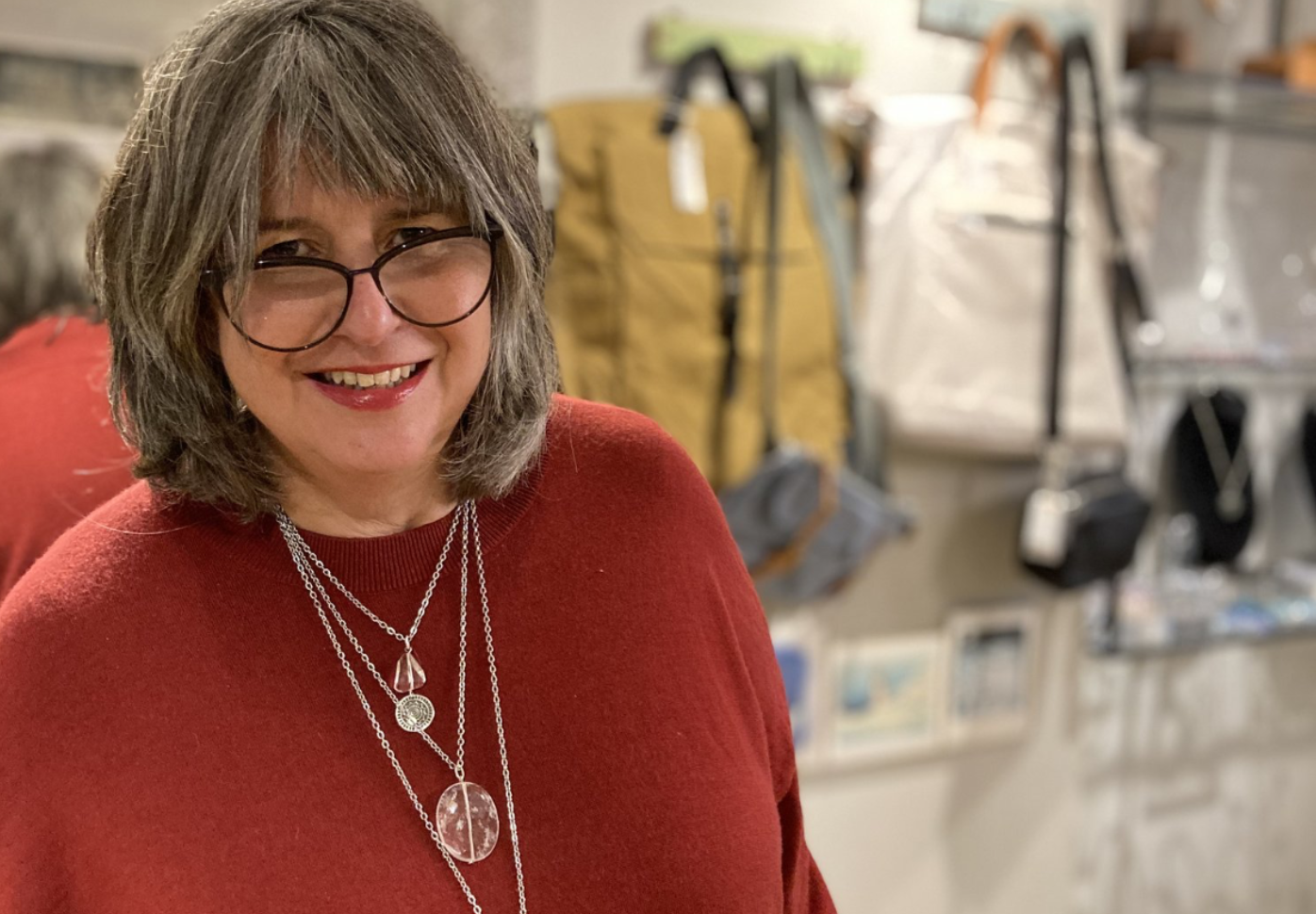 Gill Clement wearing her jewellery in her studio
