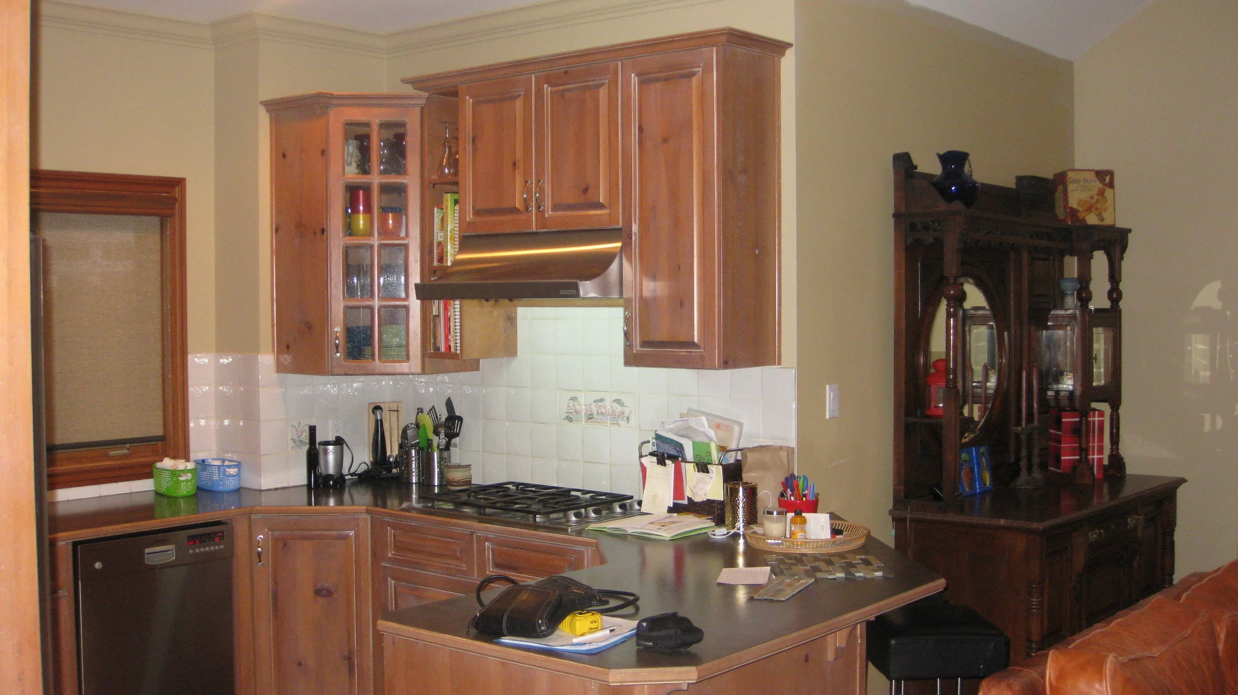 BEFORE: The Kitchen - Notice the white backsplash and the china buffet on the right.
