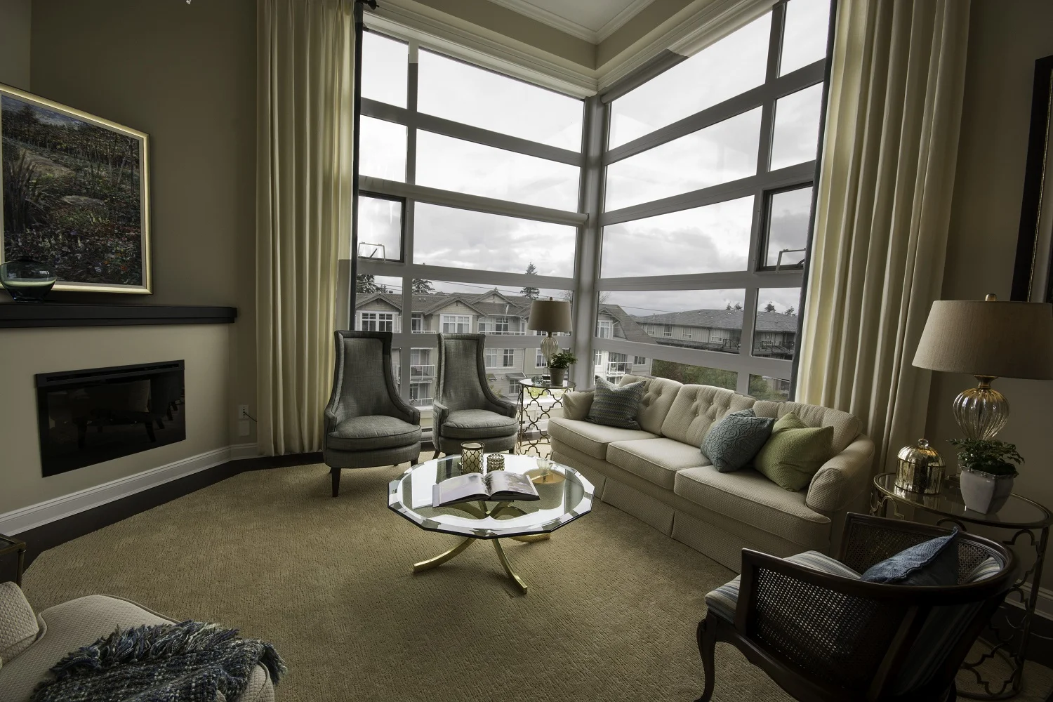 AFTER: Living Area - Notice the custom bound rug and dramatic window panels.