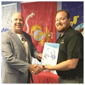 Aaron Hall, Florida ACME Secretary, presenting a scholarship to MSG Randy Schummer, USA, Ret., 2016 Veteran Recipient