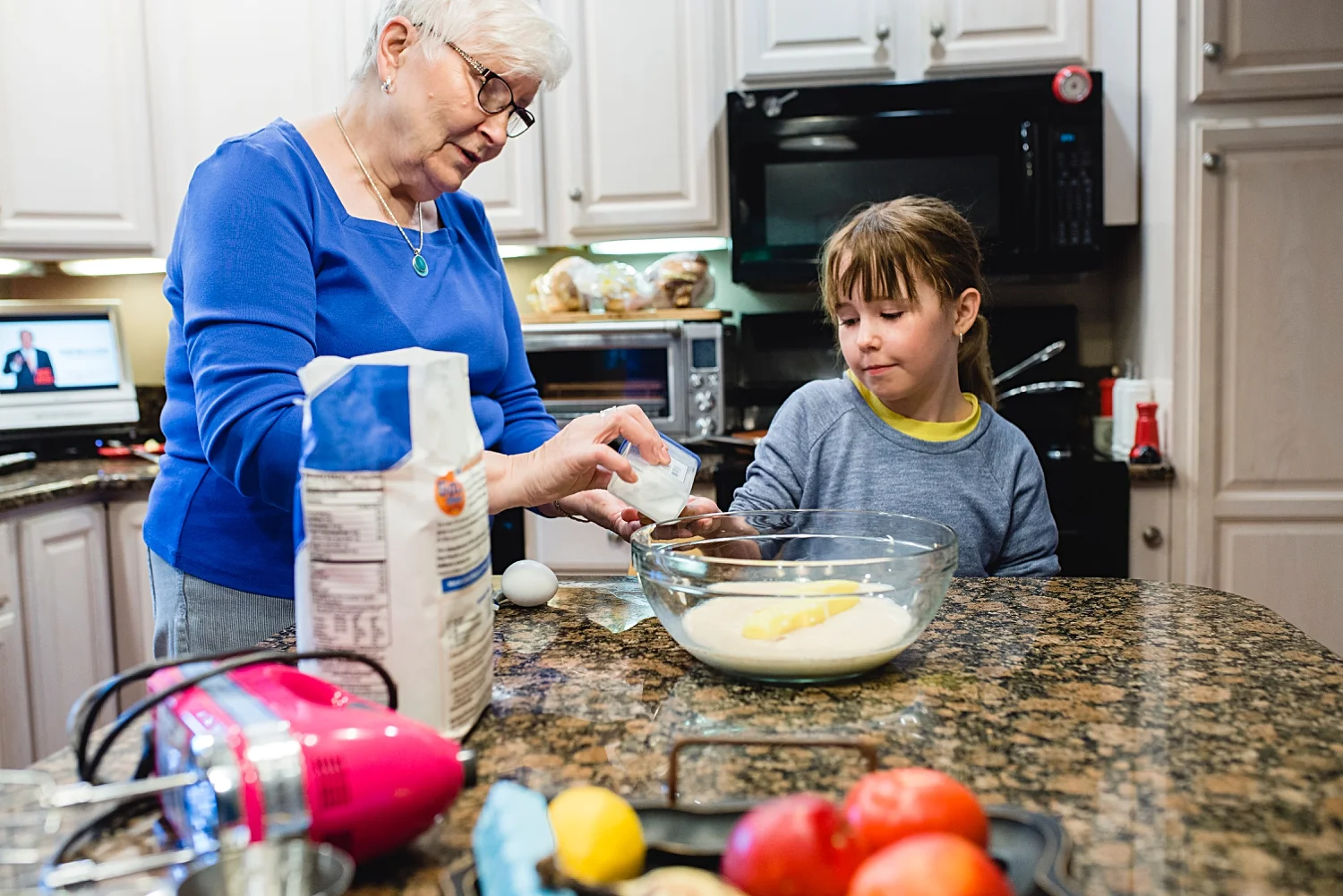 Mom teaching my daughter to make Finnish pulla bread while we were on vacation. Photos by Denver Family Photographer, Kristiina Craven.