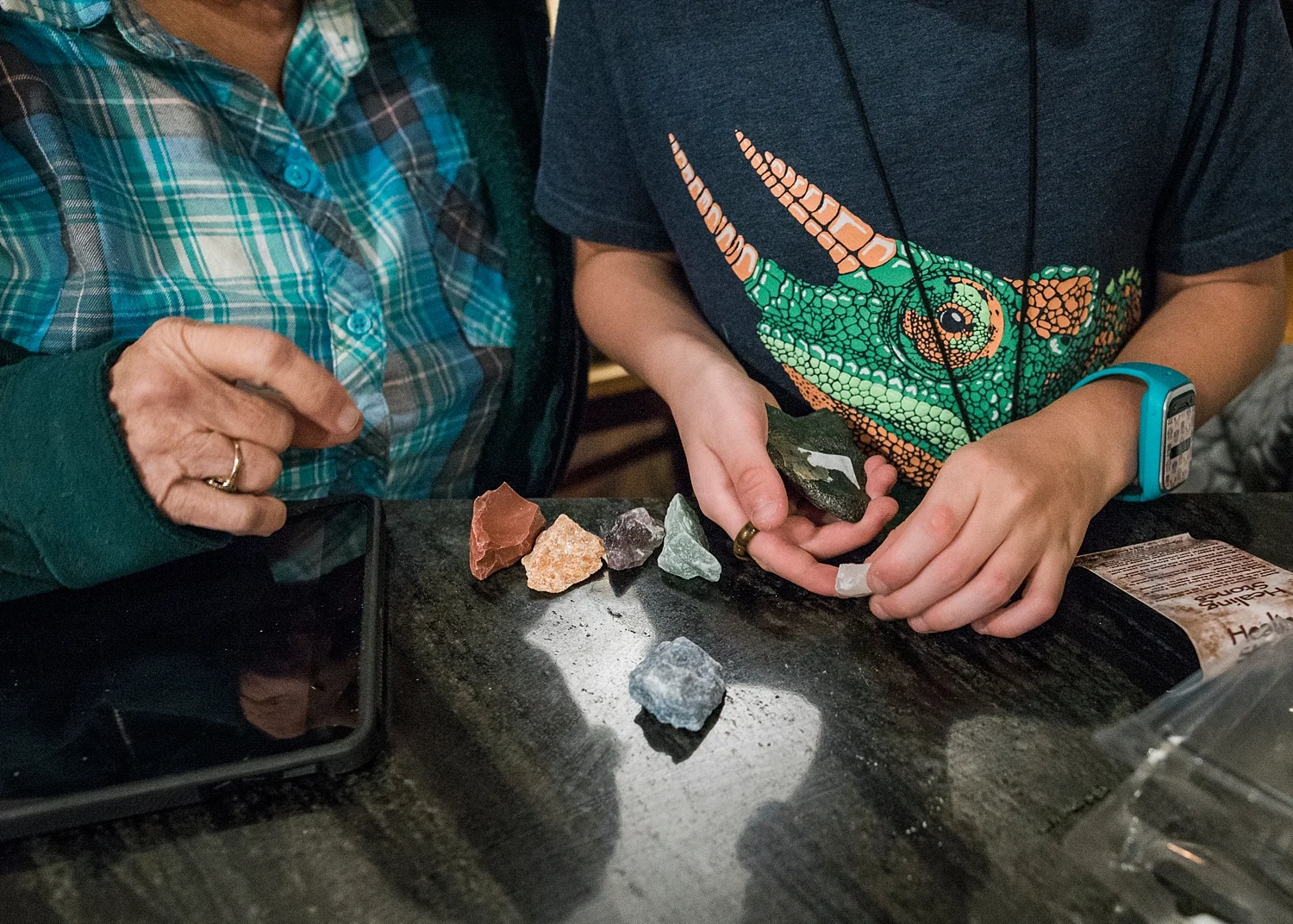 Townes sorts through his gems and rocks with his grandmother after a big haul from New Mexico while roadschooling. | GettingUnschooled.com