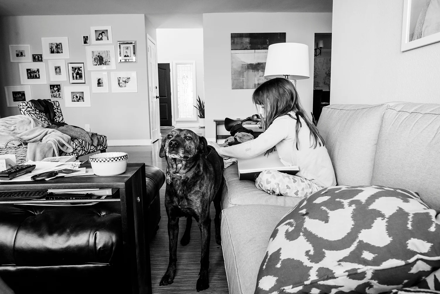 Kate gives Maggie a back scratch during our unschooling morning reading time. | GettingUnschooled.com | #homeschool #unschool #deschool #homeschoolreading
