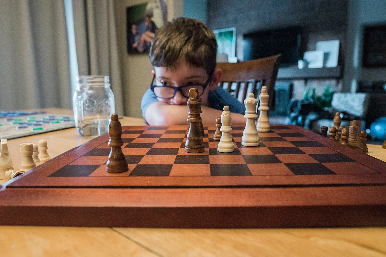 Townes thinks about his next chess move from latest Week in the Life of an Unschooler. | GettingUnschooled.com | #unschool #homeschool #chessclass #deschooling
