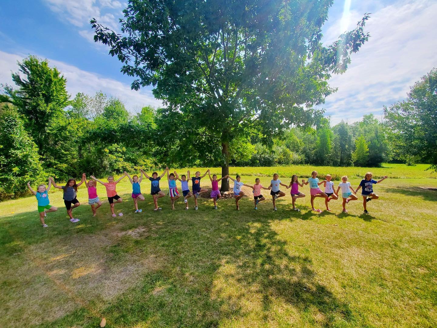 Butterfly Kids Yoga trees under trees.jpeg