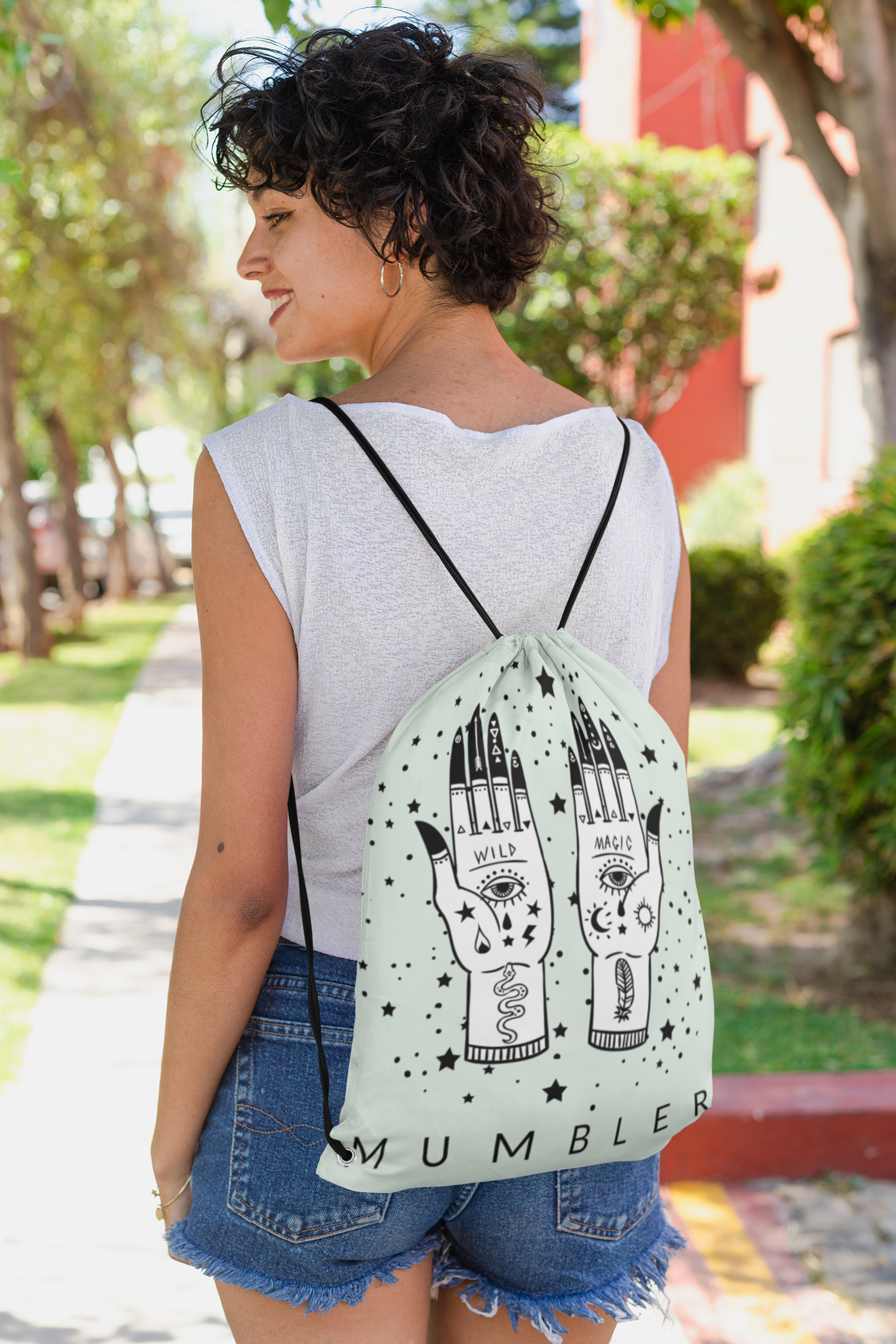 mockup-of-a-short-haired-woman-with-a-drawstring-bag-on-her-back-27570.png