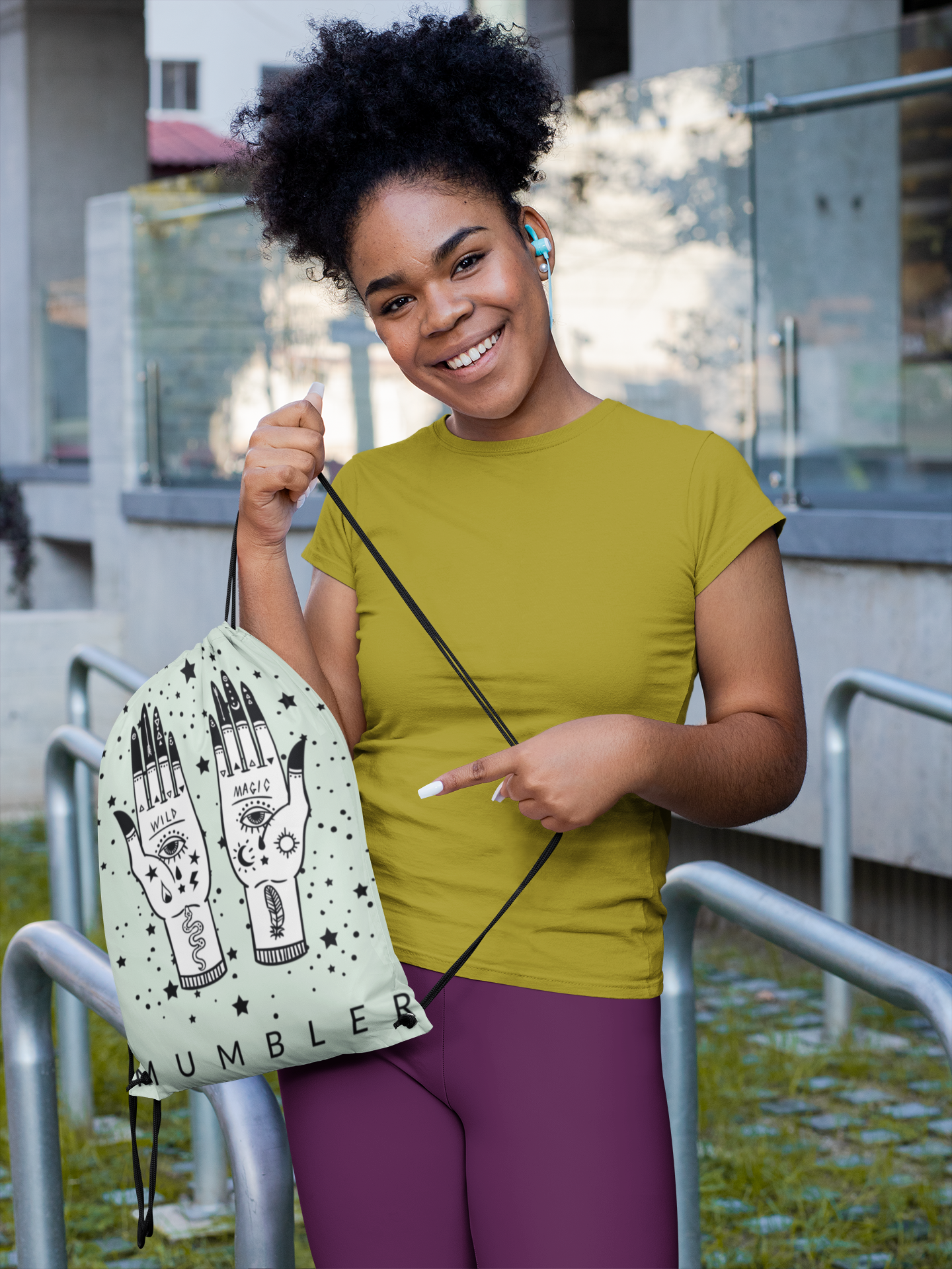 mockup-of-a-woman-pointing-at-her-drawstring-bag-31340.png