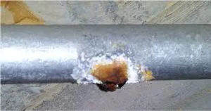 corroded pipe with leak.jpg