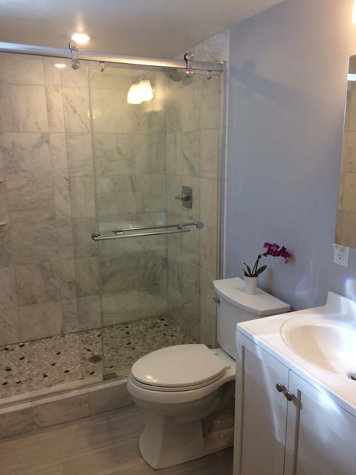 Basement bath with marble and pepples