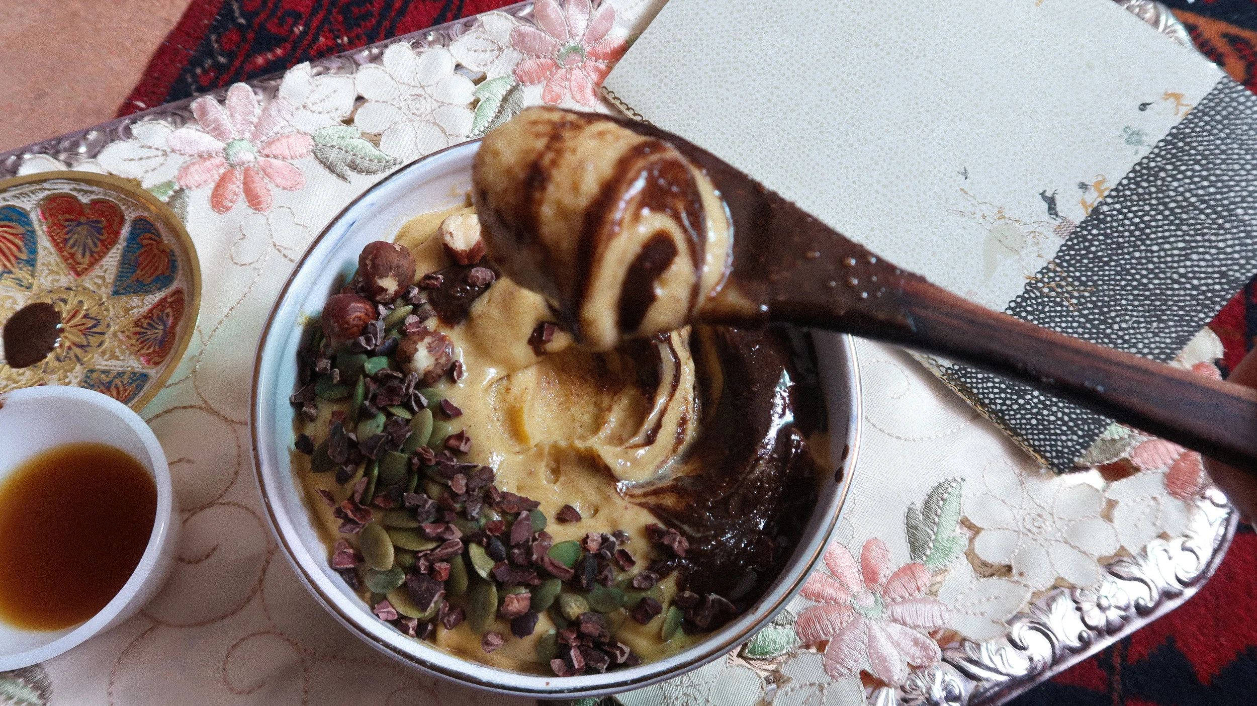 Swirled with chocolate hazelnut butter and topped with cacao nibs and pepitas 