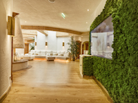 Live moss climbs the spa walls