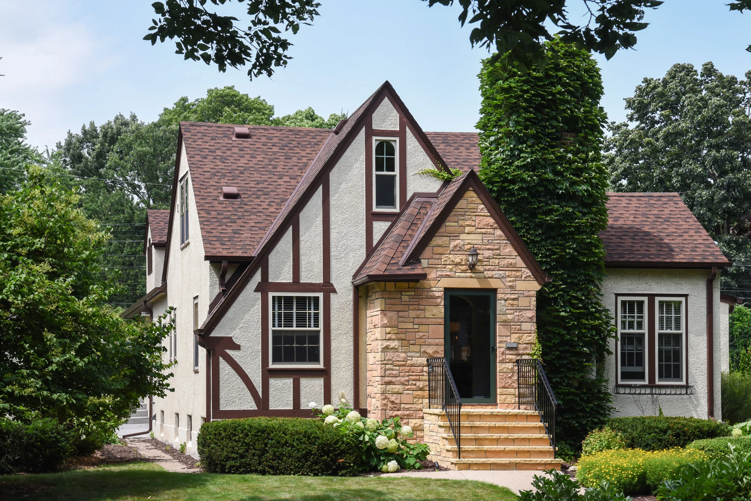 Facade: roof lines at addition take inspiration from existing house