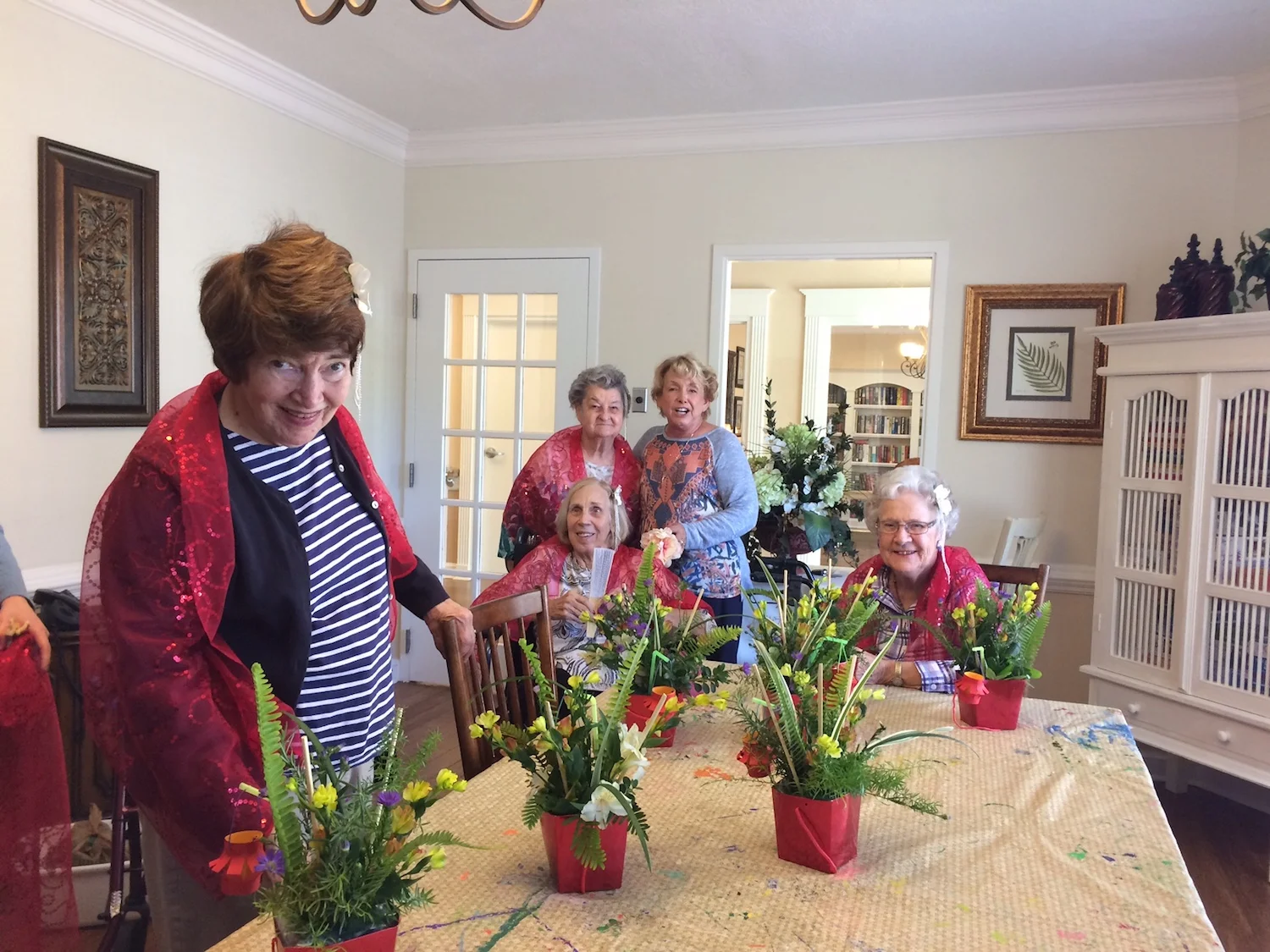 Member Alice Caldwell helps residents prepare centerpieces for the dining room