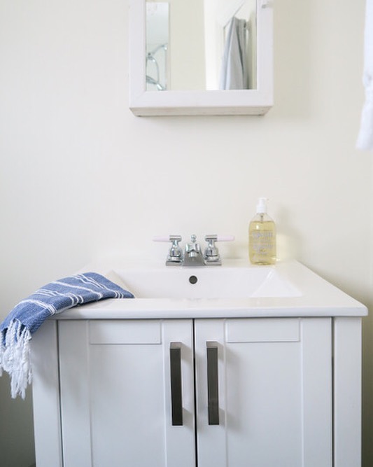 Before &amp; After of a much needed little bathroom renovation! The details and gory before pictures (have you ever seen a faucet attached by duct tape?!), are in the link in profile. #debnelsondesign #bathroomrenovation #smallbathroomdesign #beforea