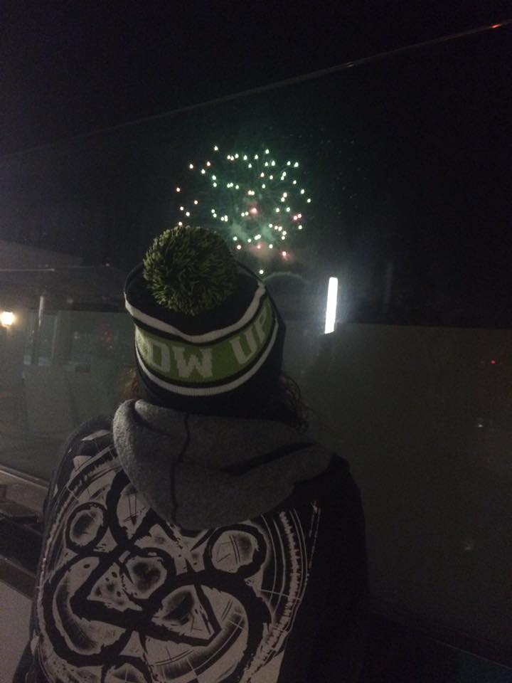 Ryan snuck a photo of me watching the fireworks from the roof at Carousel on one of our trips last winter.