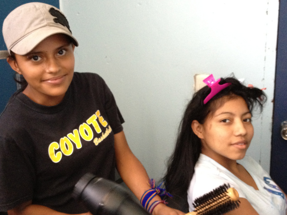 Yahira (left) during her beauty training class with Nancy (right)
