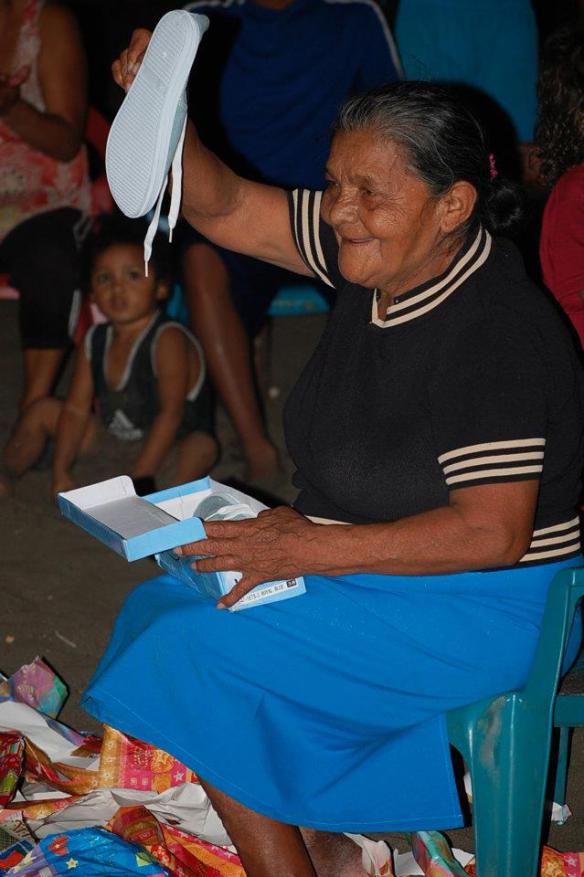 Grandma CiCi opening presents during last year’s beach Christma