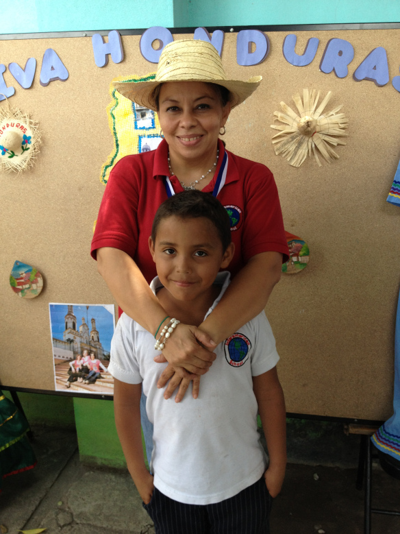 Jonatan and his teacher at the school’s Honduran festival.