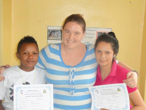 Sara (right) with Escarleth and Amber after completing her barber training program