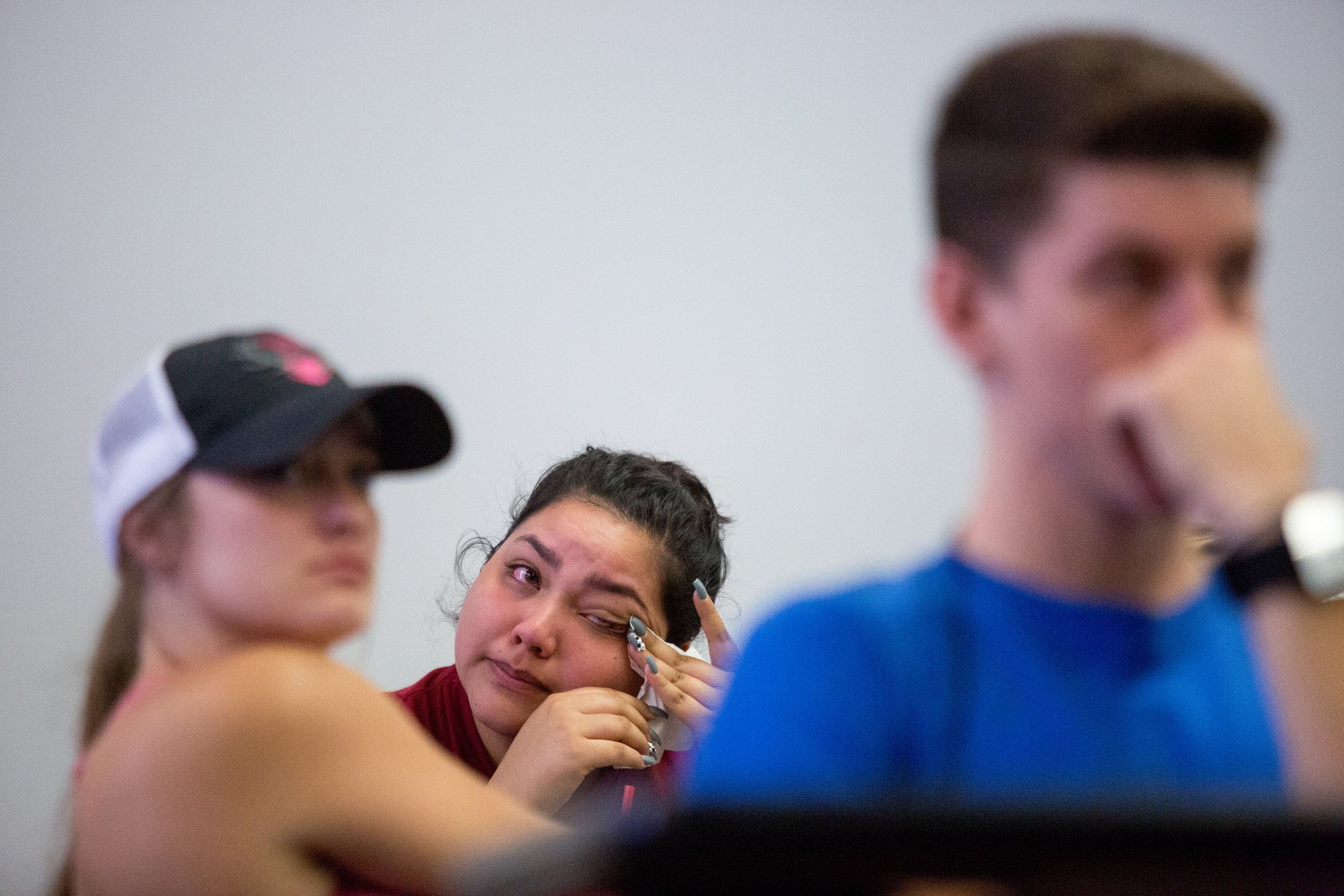  Maria Armenta (center) cries during Arizonans for Gun Safety’s talk with her classroom behavior strategies class at Arizona State University. When Armenta was a child, her best friend was walking home from school without her one day and was shot in 