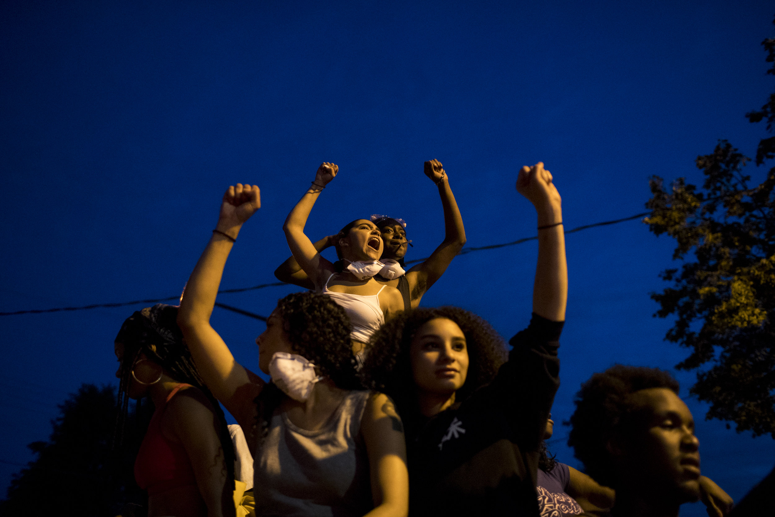  Mia Holmes (upper left) chants from the roof of a car during a march from the Minnesota State Capitol to I94 following Jeronimo Yanez’ not guilty verdict, on Friday, June 16, 2017.&nbsp;(Courtney Pedroza/Star Tribune) 