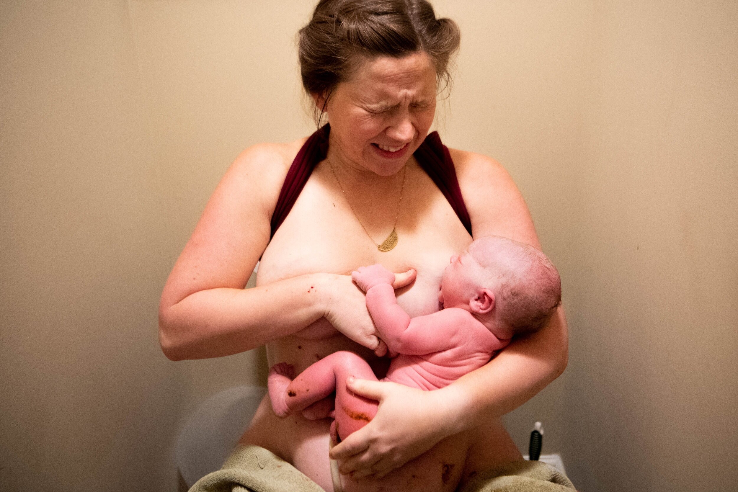  Beth Wehmeyer holds her son Henry Hudson for the first time after giving birth at their home Saturday, Aug. 24, 2019, outside Lebanon city limits. Women across rural Tennessee are choosing home births for many reasons, including personalized care, l