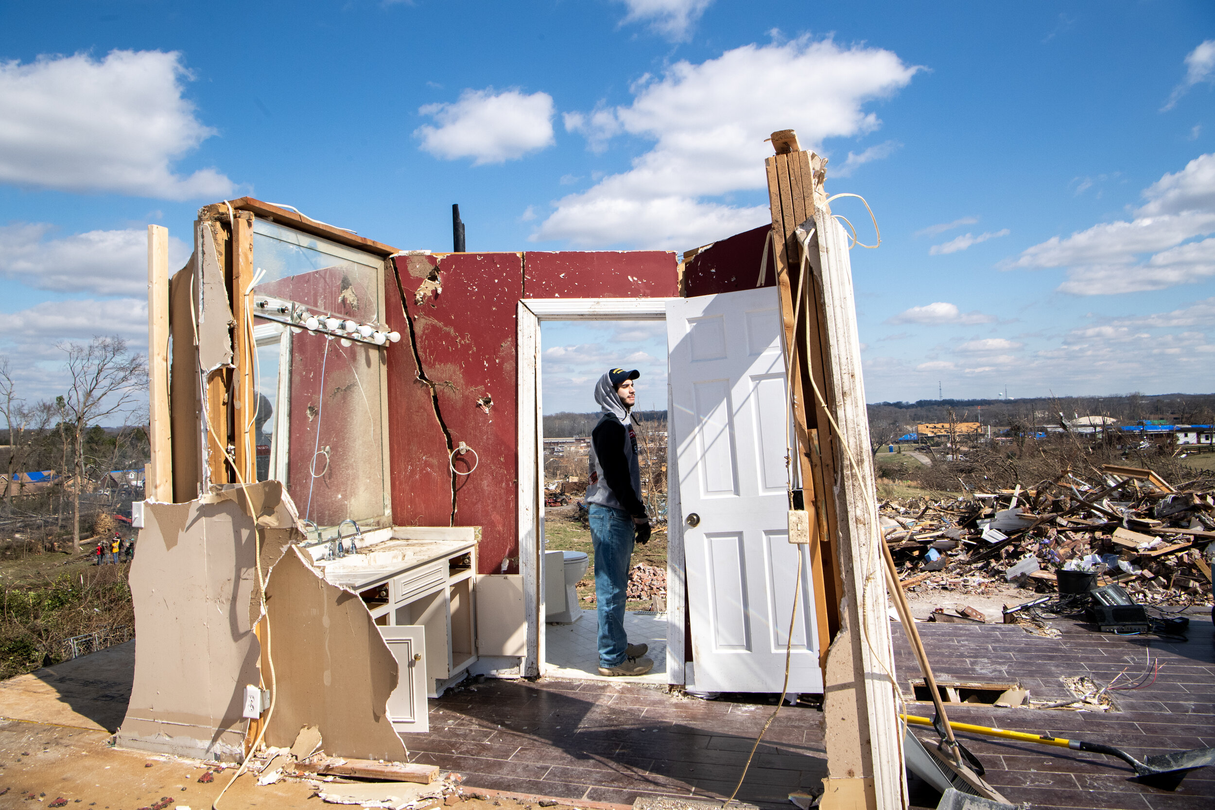  Mark Broekhuizen, 17, walks through the remains of Ken Gluck's house in Mt. Juliet, Tenn., on Friday, March 6, 2020. The walls are the only ones left standing following the tornado that ripped through Middle Tennessee and is where Gluck hid during t