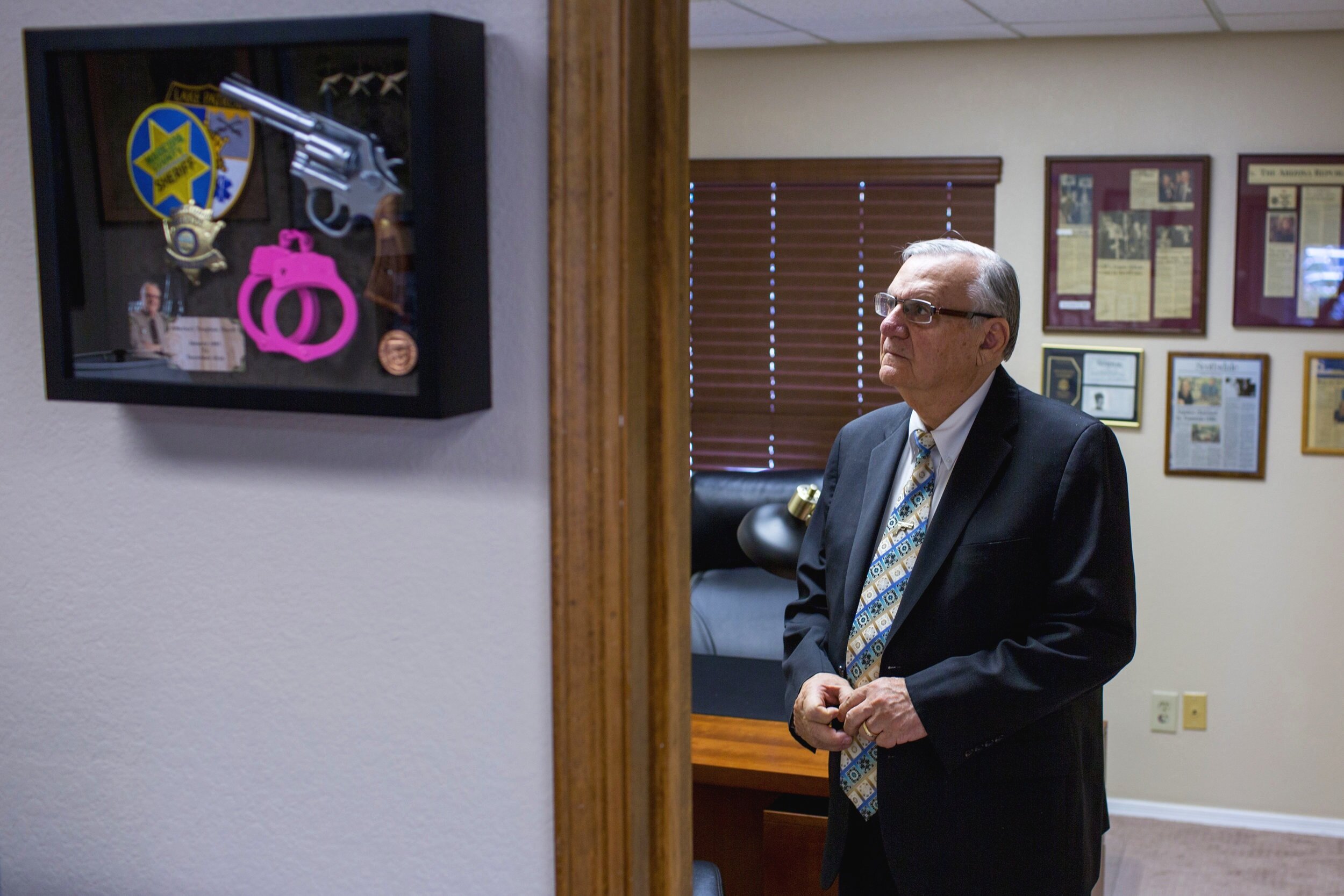  Joe Arpaio looks at newspaper clippings of himself at his office in Fountain Hills, Ariz. Arpaio was defeated for re-election as sheriff of Maricopa County, Ariz.&nbsp;(Courtney Pedroza for The New York Times) 