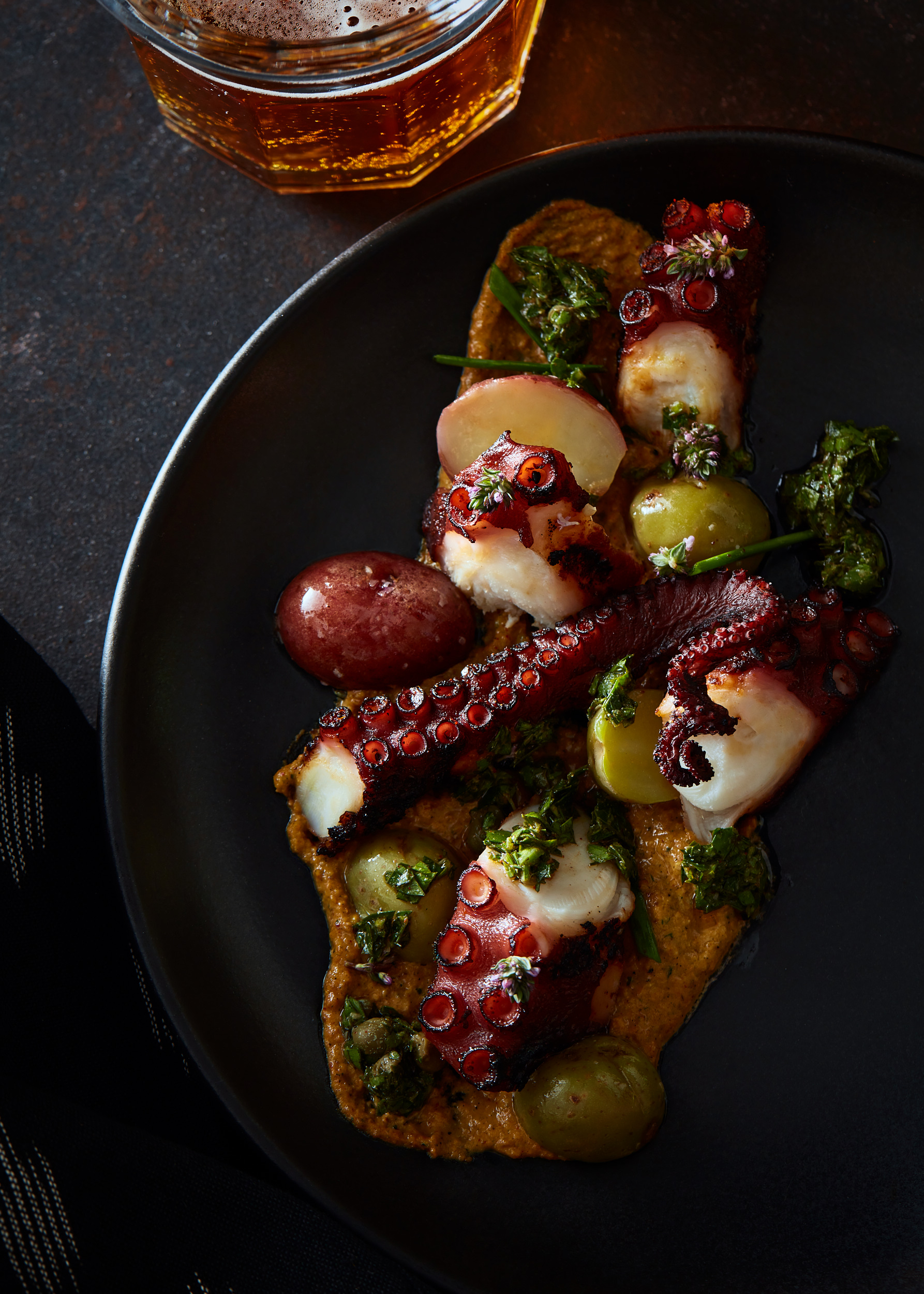 Grilled octopus with smoked pistachio romesco, roasted baby potatoes and chimichurri.