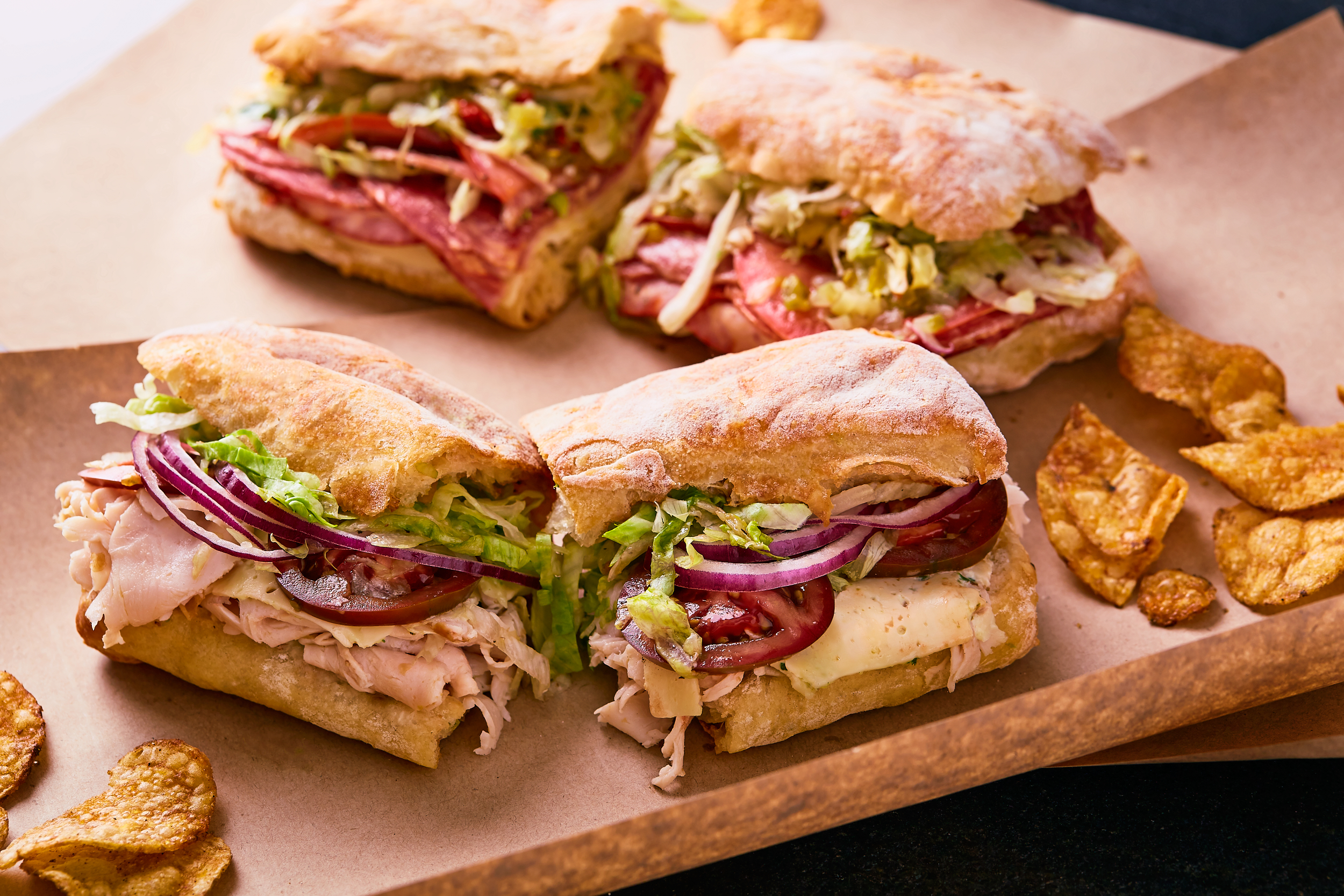 Turkey sandwich, classic Italian sub and barbecue chips.