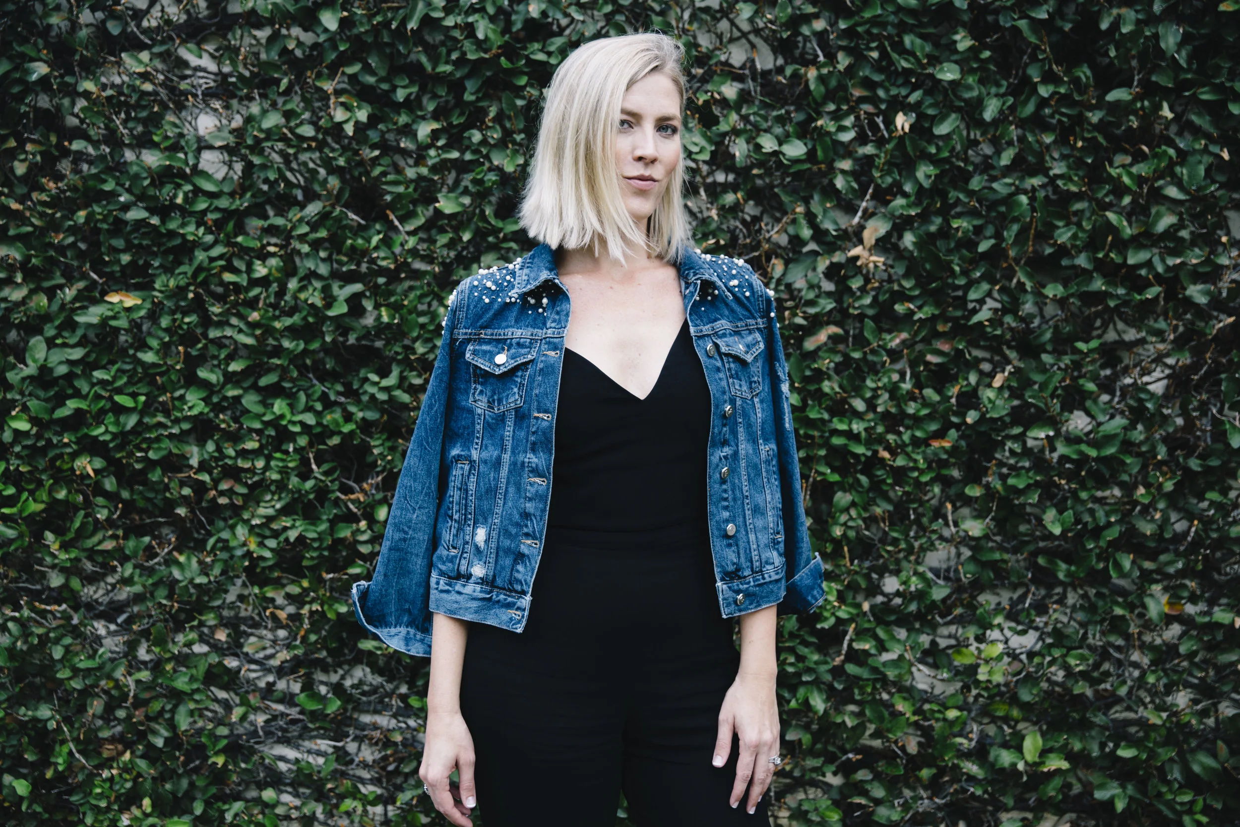 The Borrowed Babes Fashion Blogger Stephanie Mack Kearney wearing Anthropologie Embellished Denim Jacket with Cushnie Et Ochs Jumpsuit from Rent the Runway 