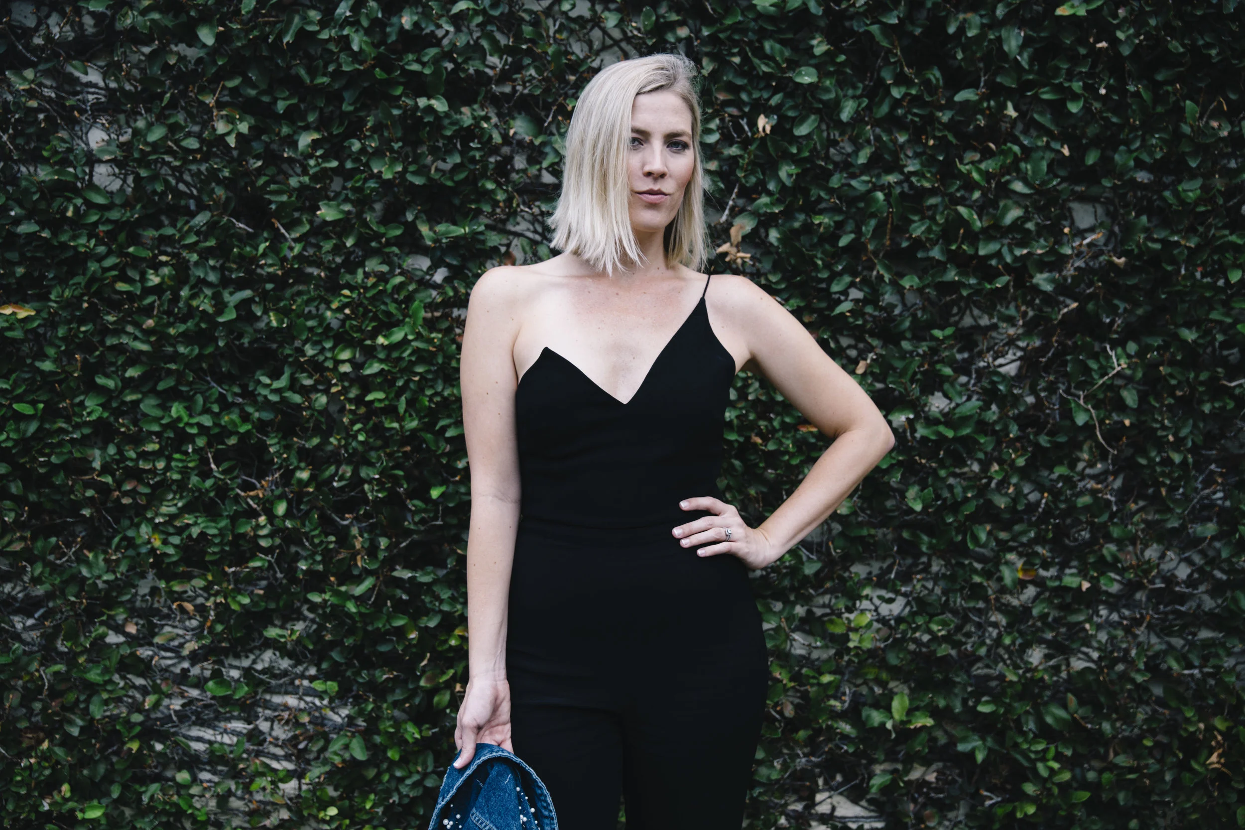The Borrowed Babes Fashion Blogger Stephanie Mack Kearney wearing Anthropologie Embellished Denim Jacket with Cushnie Et Ochs Jumpsuit from Rent the Runway 