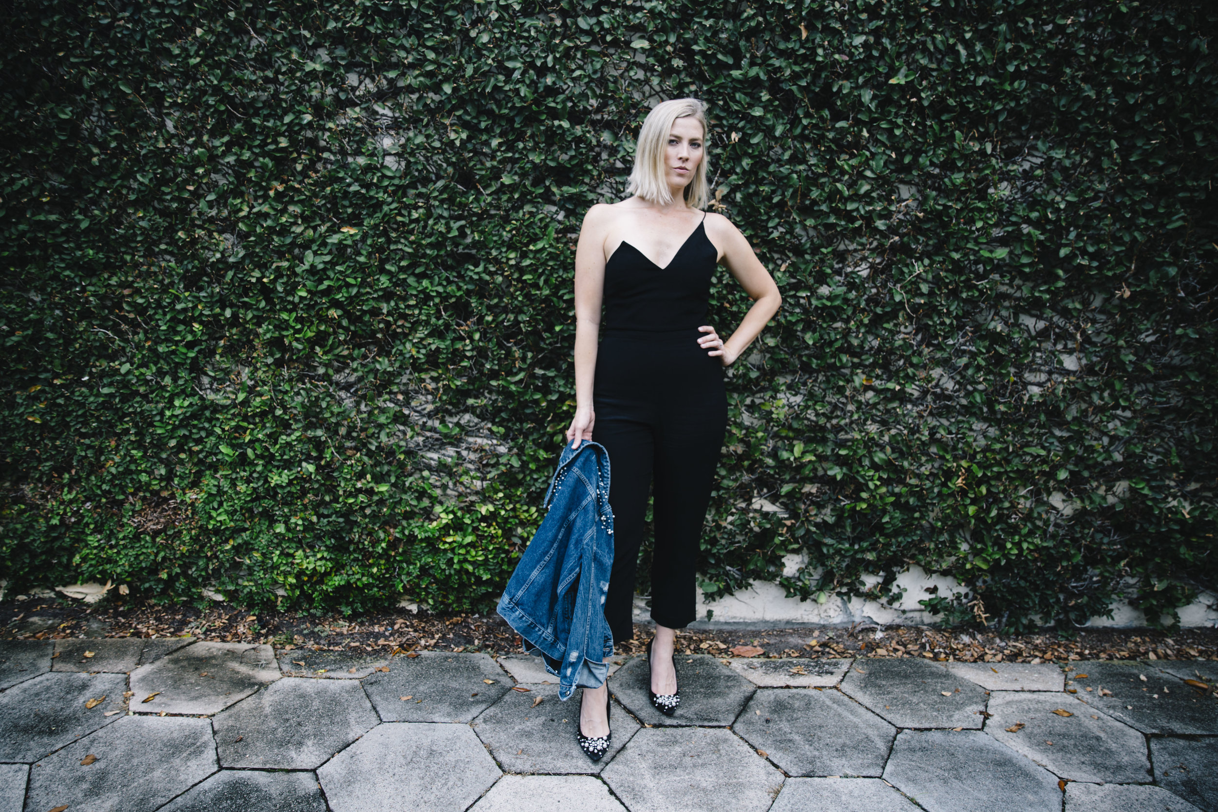 The Borrowed Babes Fashion Blogger Stephanie Mack Kearney wearing Anthropologie Embellished Denim Jacket with Cushnie Et Ochs Jumpsuit from Rent the Runway 