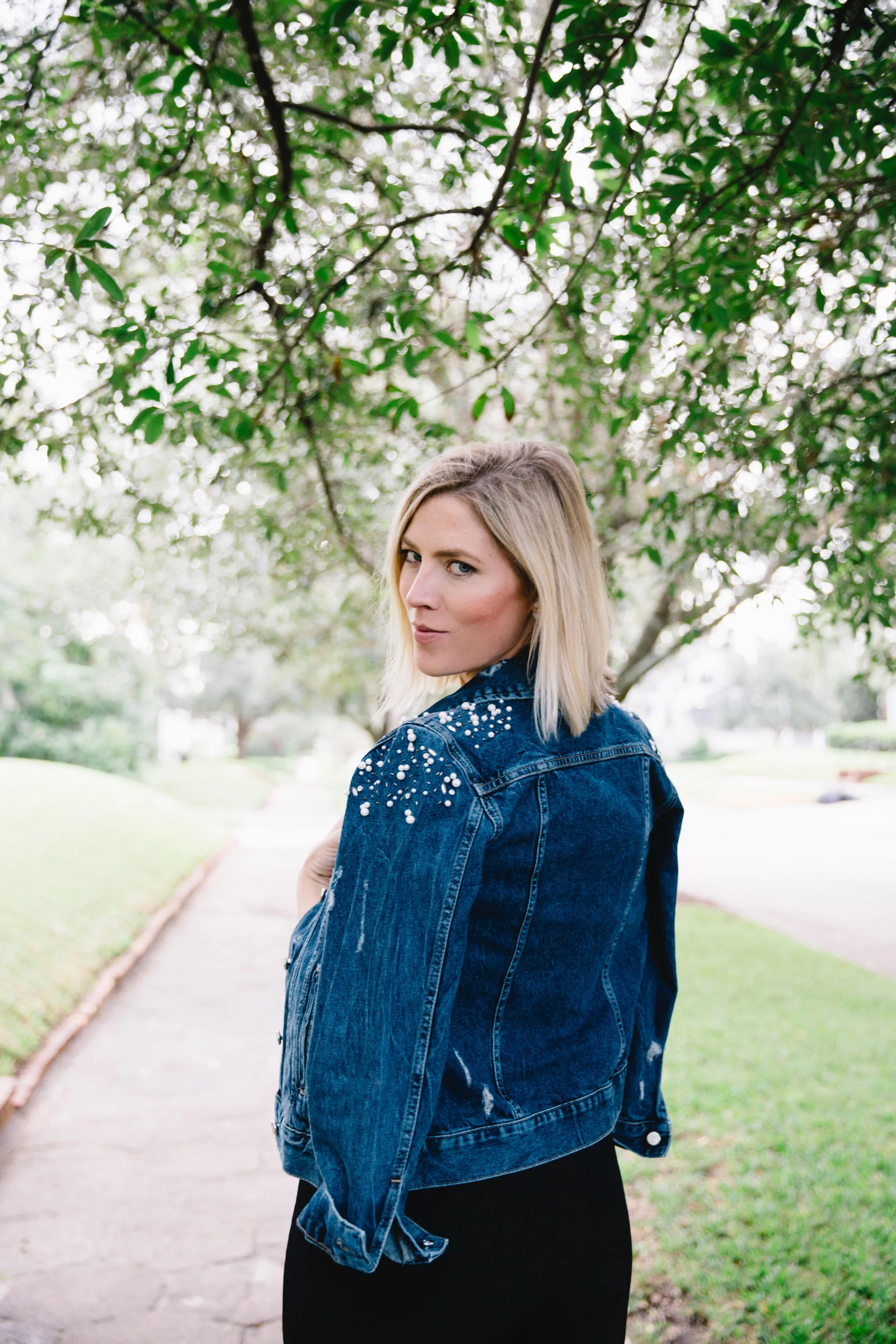 The Borrowed Babes Fashion Blogger Stephanie Mack Kearney wearing Anthropologie Embellished Denim Jacket with Cushnie Et Ochs Jumpsuit from Rent the Runway 