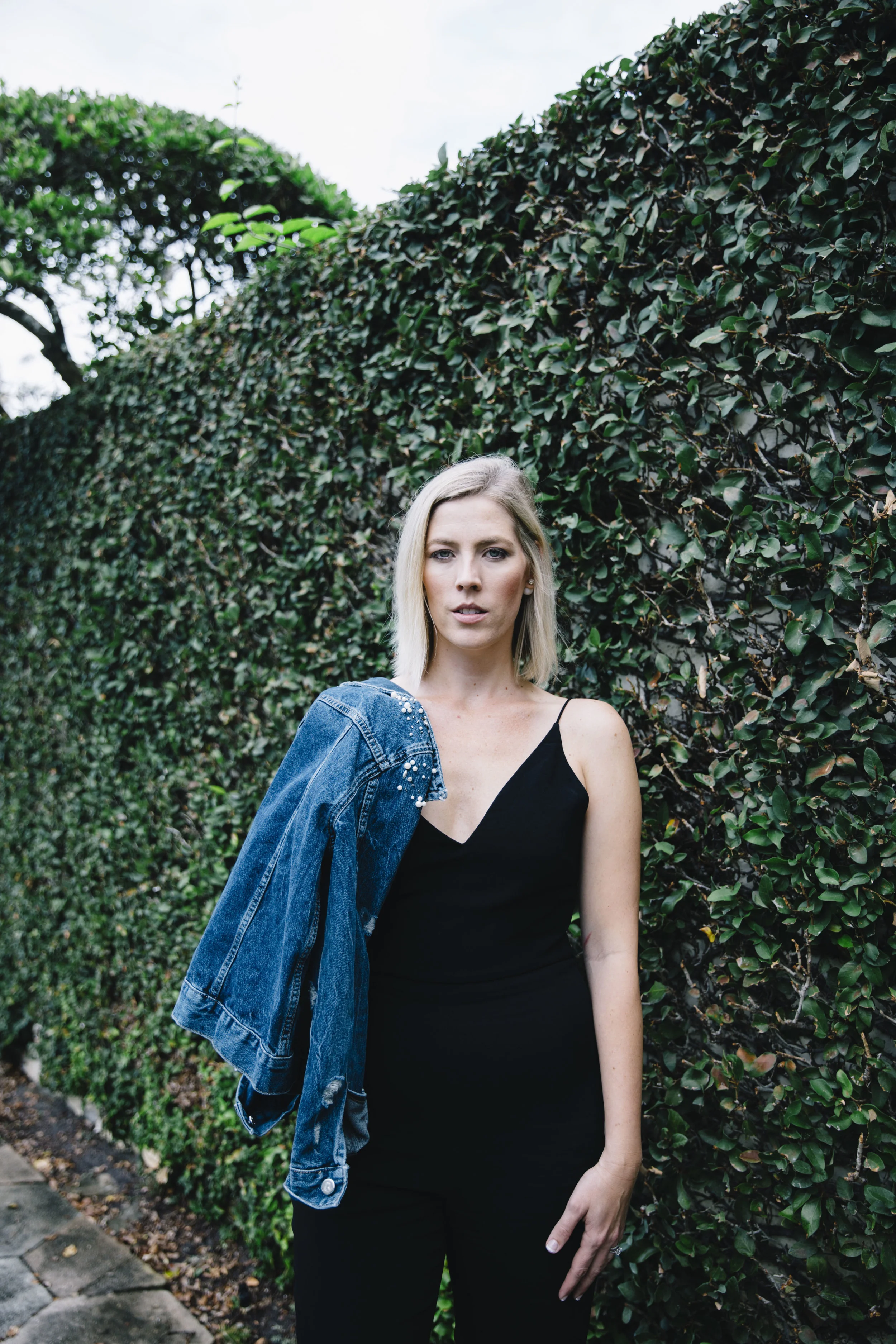The Borrowed Babes Fashion Blogger Stephanie Mack Kearney wearing Anthropologie Embellished Denim Jacket with Cushnie Et Ochs Jumpsuit from Rent the Runway 