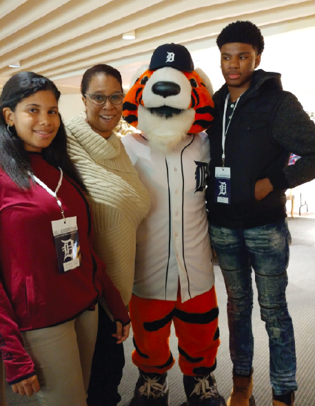 Renee Avery attending a Detroit Tigers game with her children .