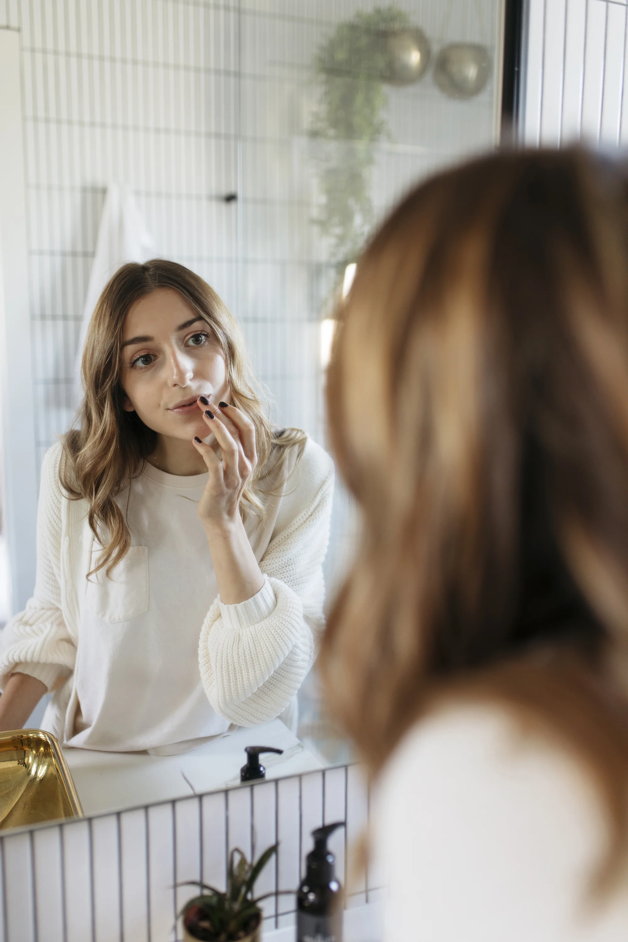 Applying lip scrub to enhance bare faced beauty