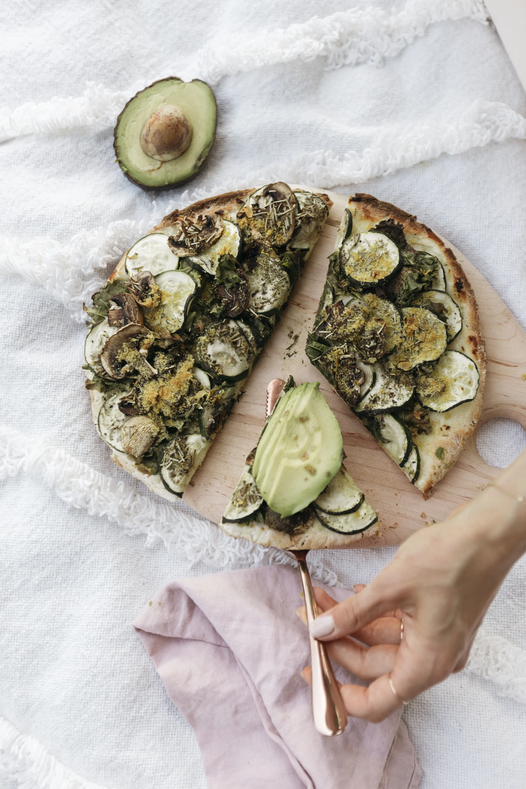 Delicious gluten free, dairy free, and vegan avocado toast pizza recipe created by creative lifestyle blogger and founder of luca creative co Emily R hess.