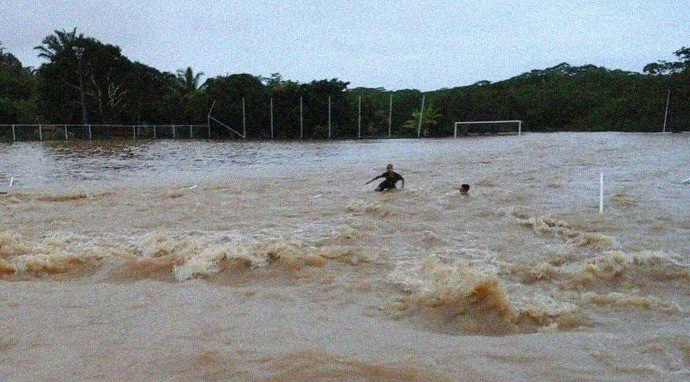 The raging flood waters wash over the Arena Massangana. 