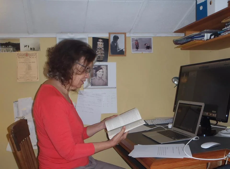 Ethel Whitty, with a picture of the book's inspiration on the wall beside her.