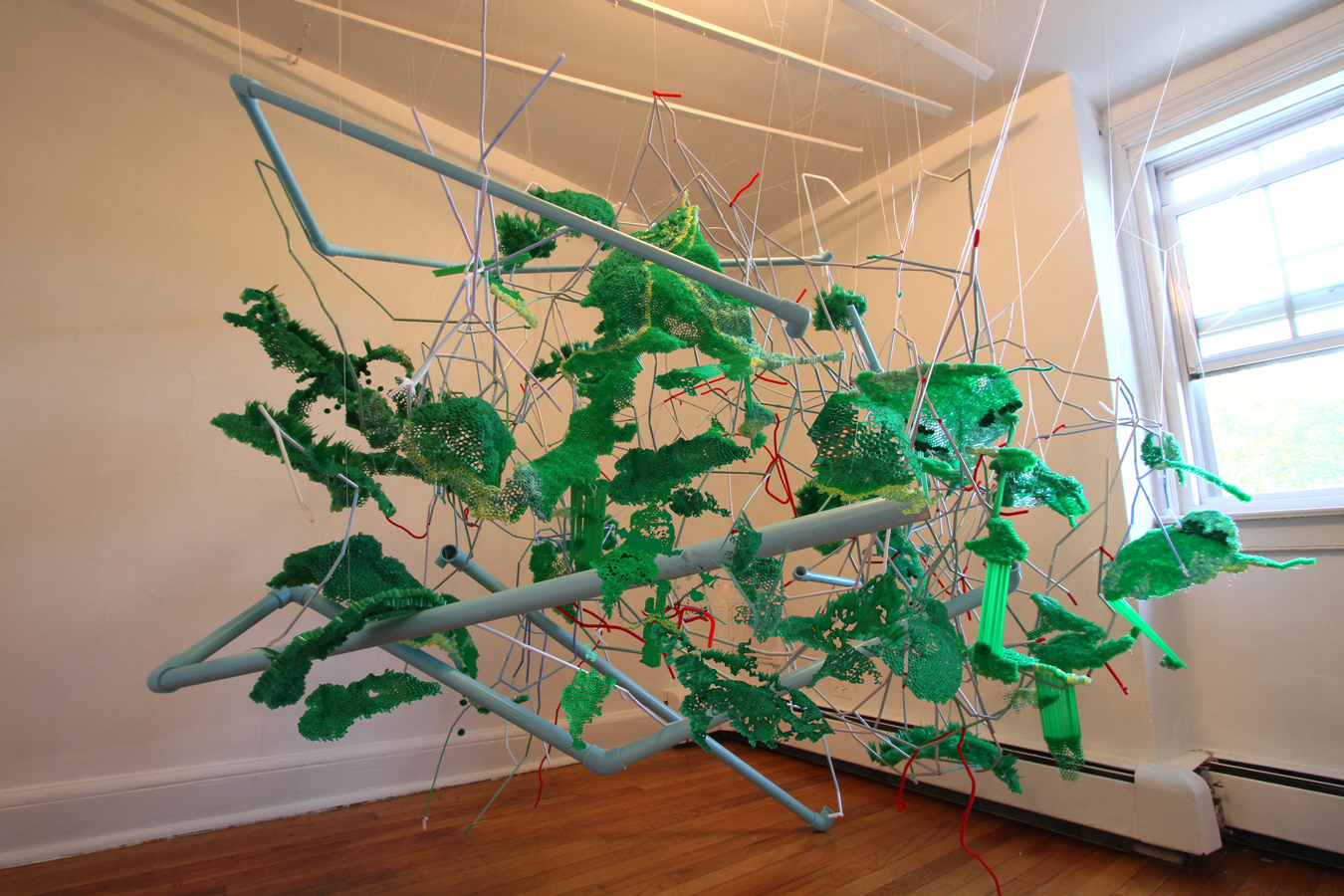 Compulsive Consumer Cartography Site-specific installation at Governors Island Art Fair. Plastic drinking straws, pvc pipe, monofilament, pipe cleaners, mixed media 8' x 9' x 10'