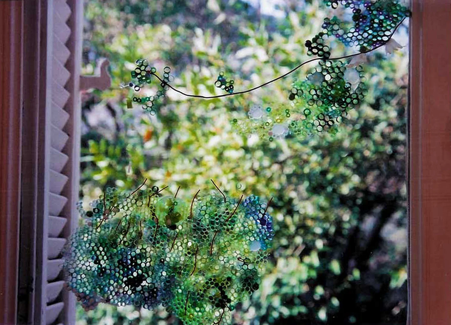 Green Window Site-specific window installation composed of plastic drinking straws, pompoms, Pearler Beads, colored wire 5' x 3' x 1"