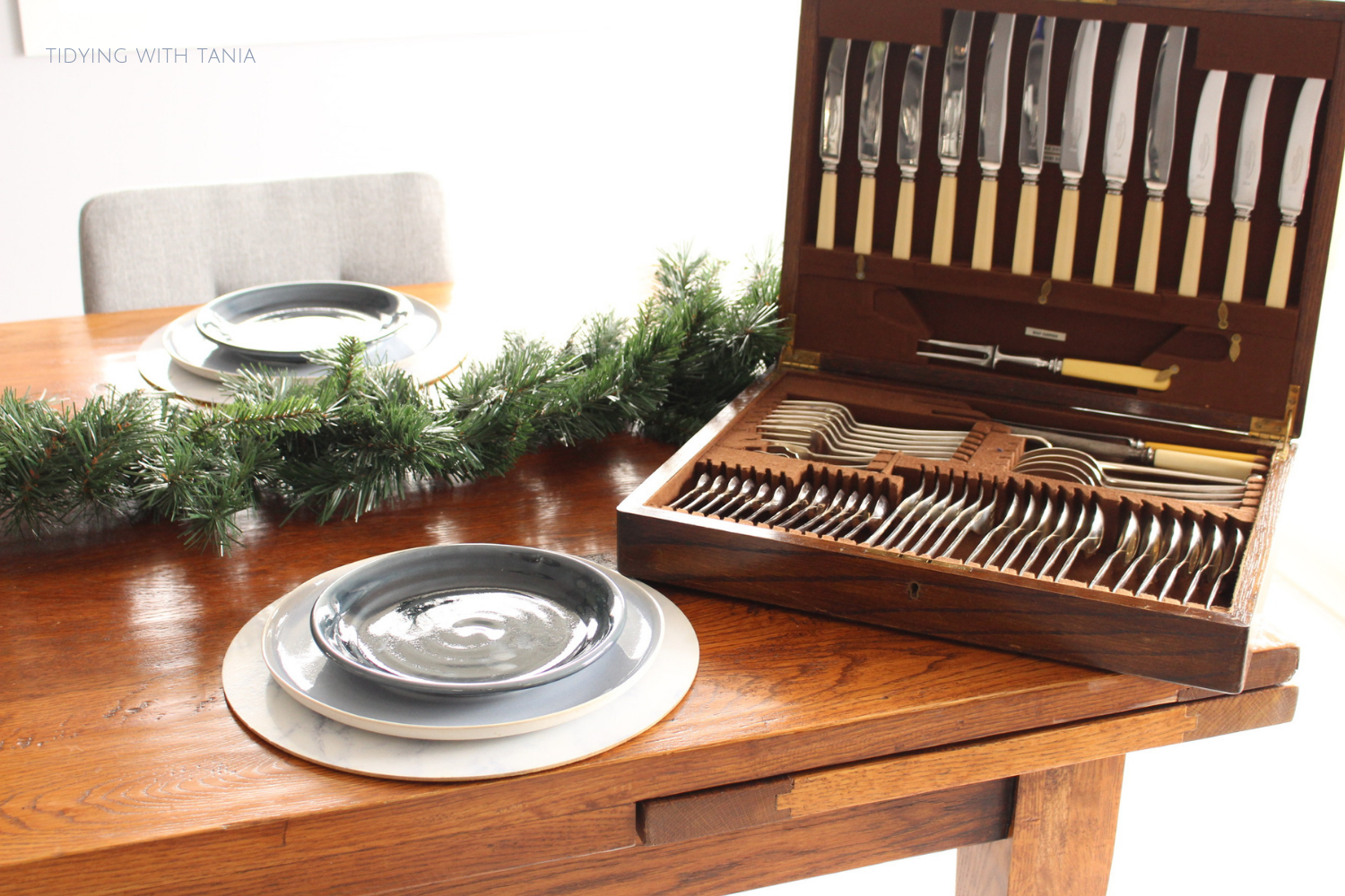 cutlery in silverwear box on dinning table.png