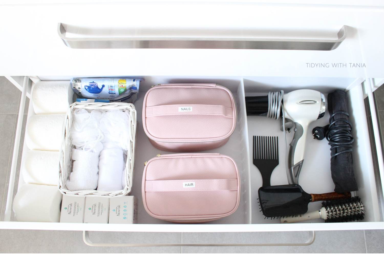 Bathroom drawer organized Hair products.png