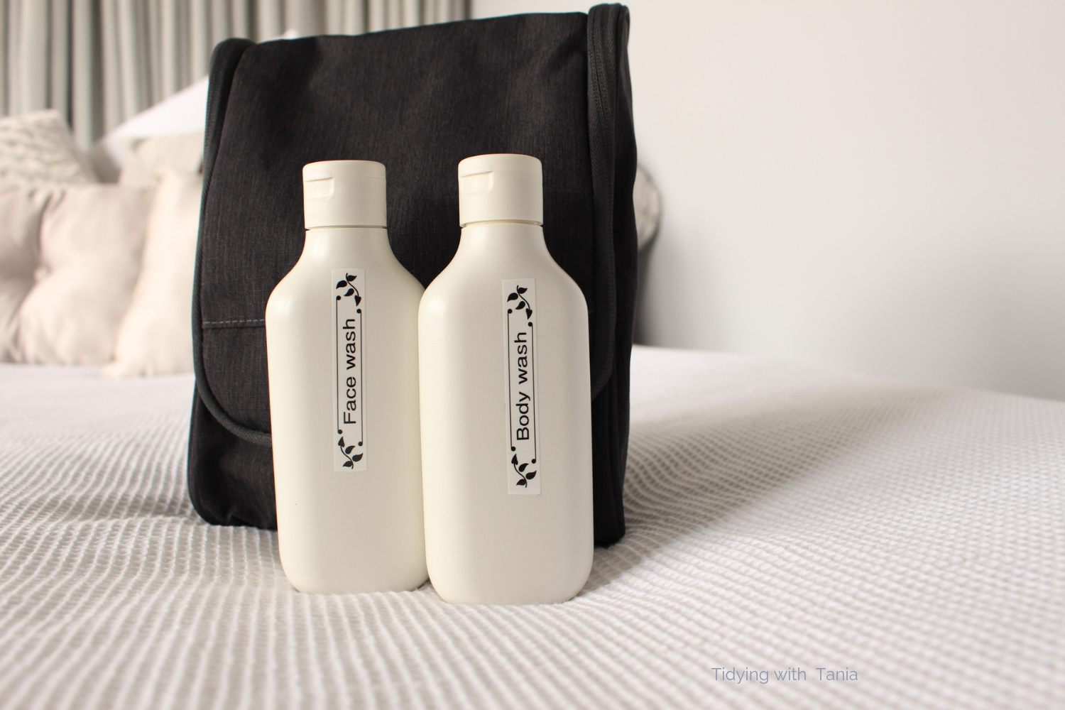 Wash bag with travel bottles.png