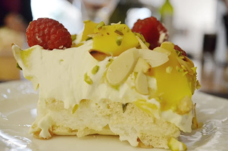 Mouth-watering rosewater and pistachio meringue with almonds, raspberries and mango