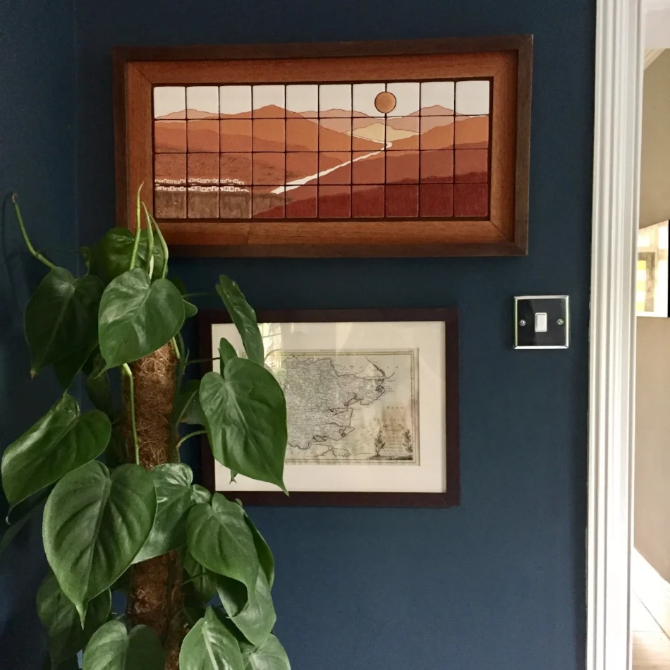 Devil's Ivy plant (ideal for rooms with limited light). A piece of art from the Chicamocha Canyon in Colombia, and an antique map of Essex we found in a market in Florence.