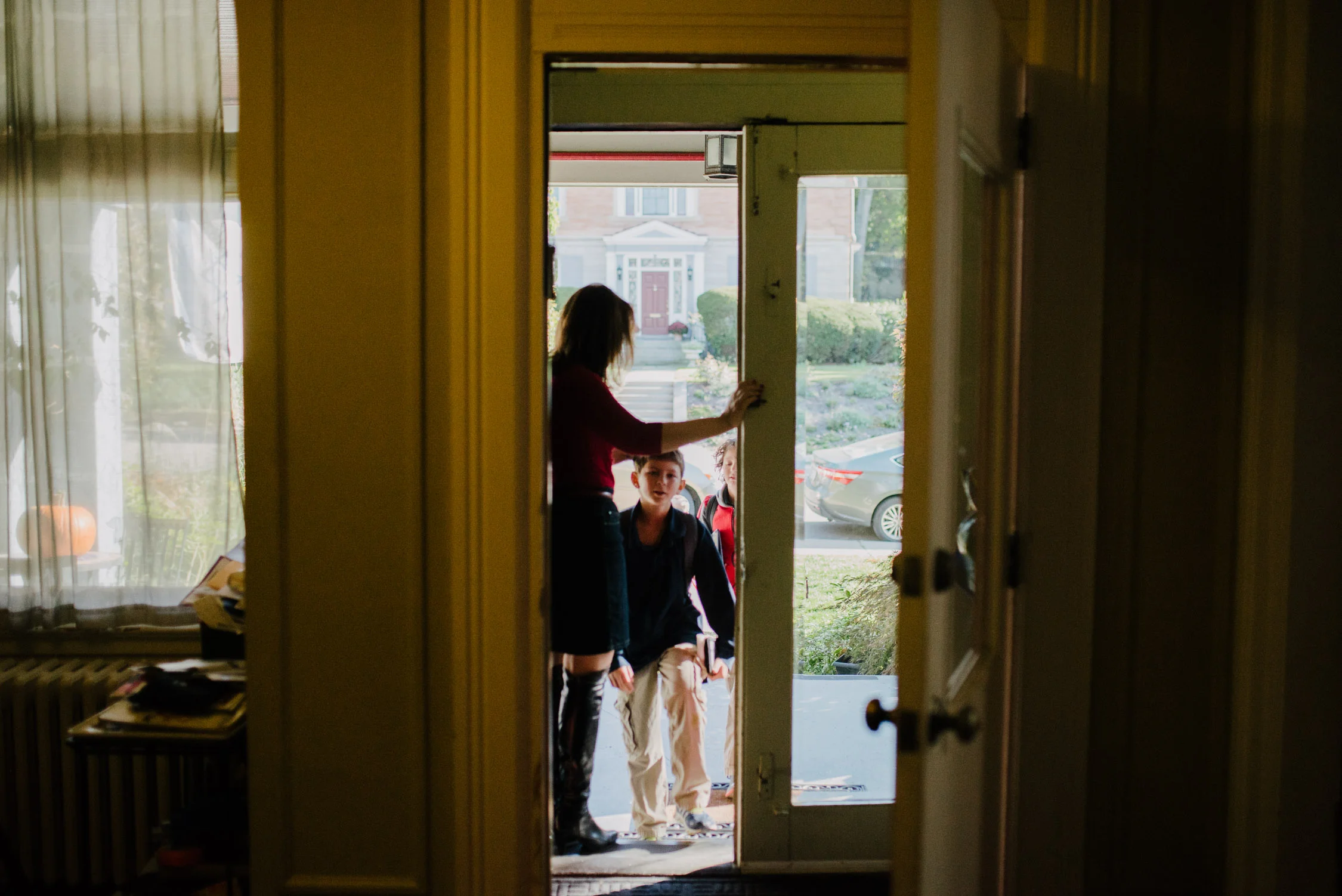 Dr. Deborah Gilboa greets her four sons as they return home from school.